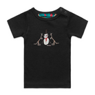 Black short sleeve babies' t-shirt featuring an image of a snowman with two kangaroos. The snowman is wearing an orange scarf and a black top hat with one brown kangaroo either side of him. The t-shirt has a red, white, and blue fabric label on the back of the neck and has two black press studs on the left shoulder.